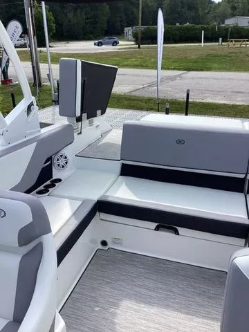Slide: The Image of 2026 Cobalt CS23 boat interior with gray seating and modern design. - 11