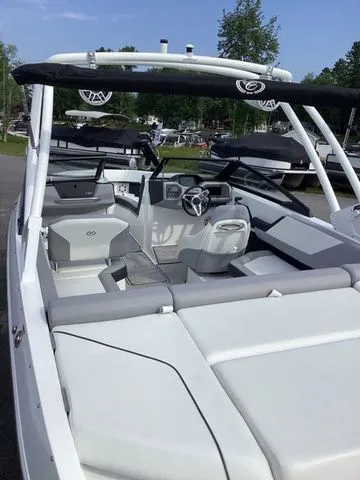 Slide: The Image of 2026 Cobalt CS23 boat with sleek interior design and modern steering wheel. - 8