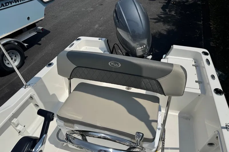 Slide: The Image of 2026 Key West 1720 CC boat interior with seating and Yamaha 90 engine. - 3