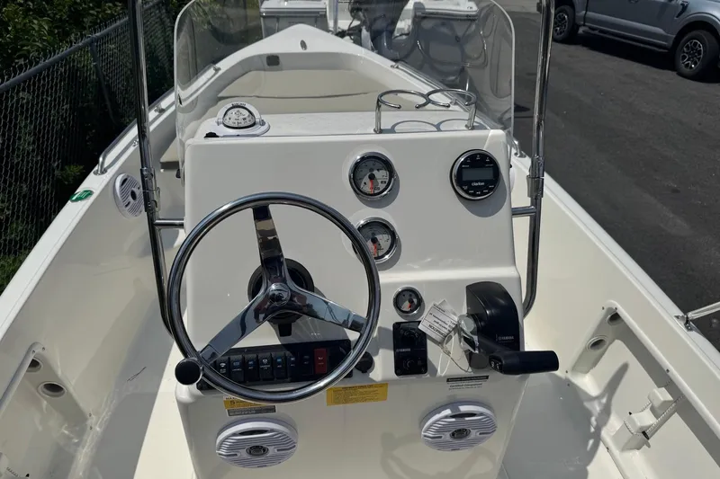 Slide: The Image of 2026 Key West 1720 CC boat console with steering wheel and gauges. - 4