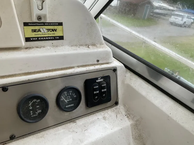 Slide: The Image of Control panel of a 2009 Key West 2300WA boat with gauges and switches. - 10