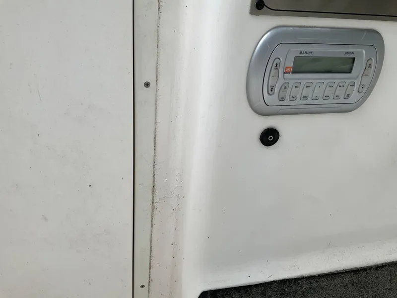 Slide: The Image of 2009 Key West 2300WA boat interior with marine radio system. - 15