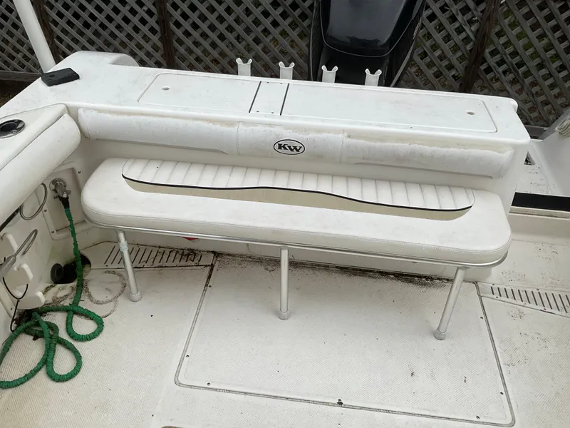 Slide: The Image of 2009 Key West 2300WA boat interior with white seating and green rope. - 25