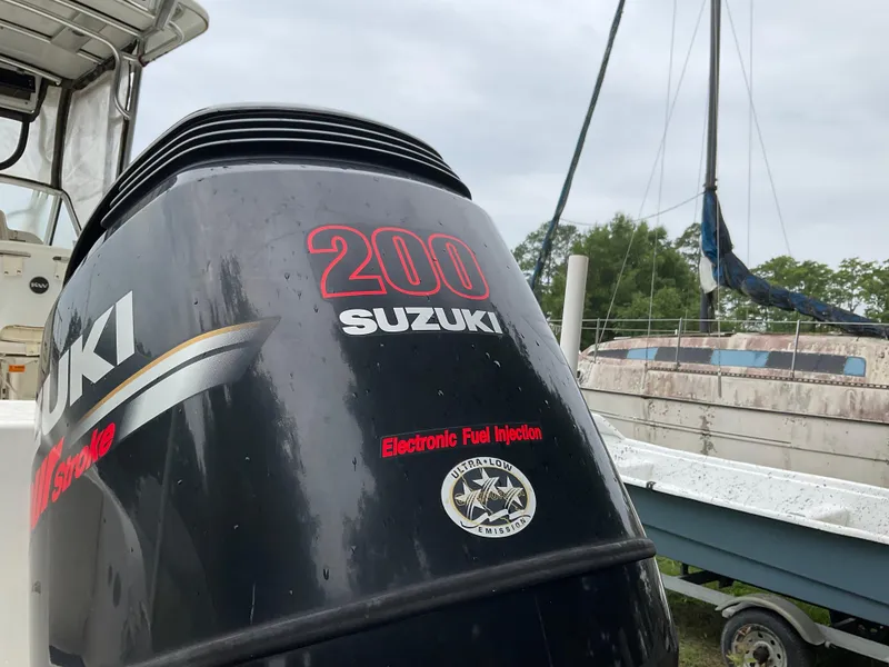 Slide: The Image of Suzuki 200 outboard motor on 2009 Key West 2300WA boat, featuring electronic fuel injection. - 34