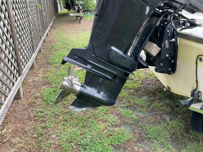 Slide: The Image of Outboard motor of 2009 Key West 2300WA boat on grassy area. - 35