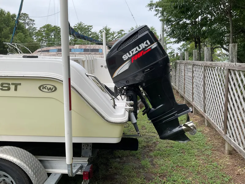 Slide: The Image of 2009 Key West 2300WA boat with Suzuki four-stroke outboard motor on trailer. - 37