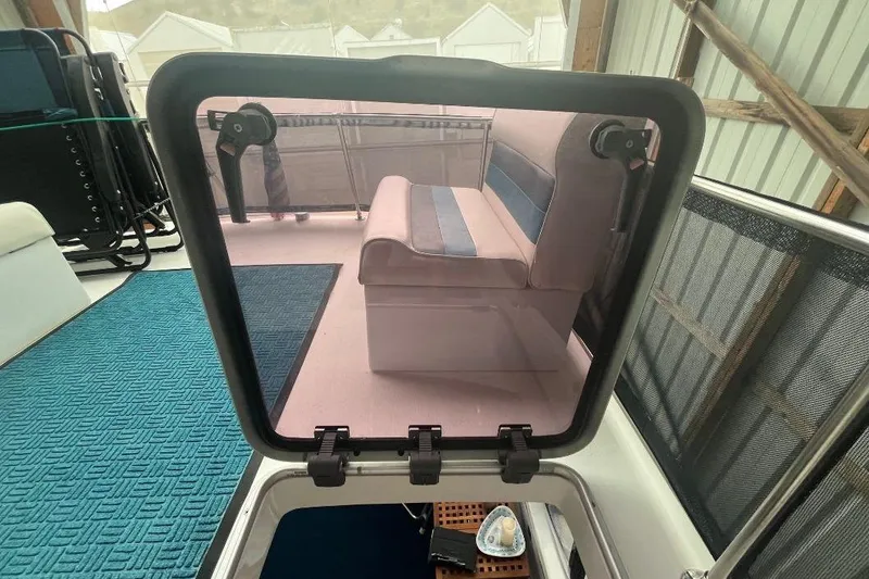 Slide: The Image of 1976 Uniflite 32 Sport Sedan interior with seating and hatch view. - 39