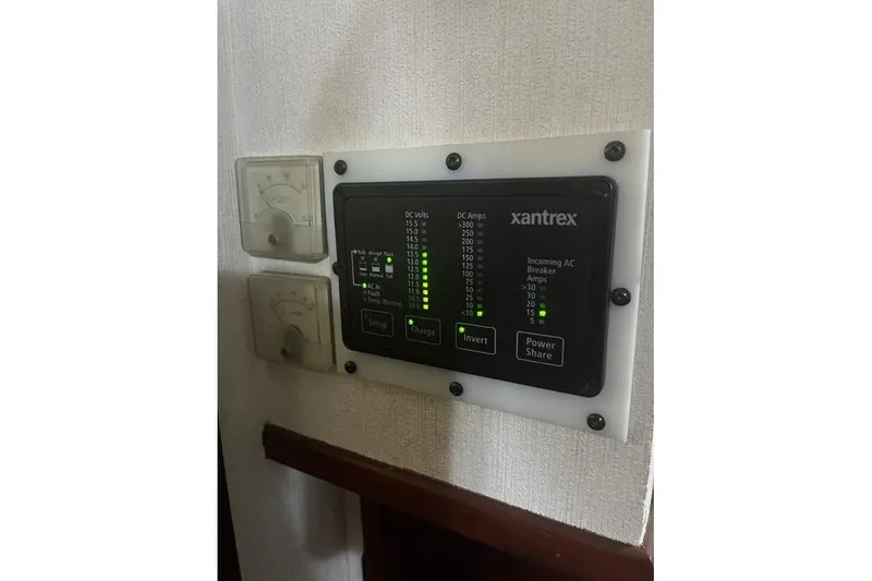 Slide: The Image of Control panel on a 1976 Uniflite 32 Sport Sedan boat, featuring Xantrex system. - 62