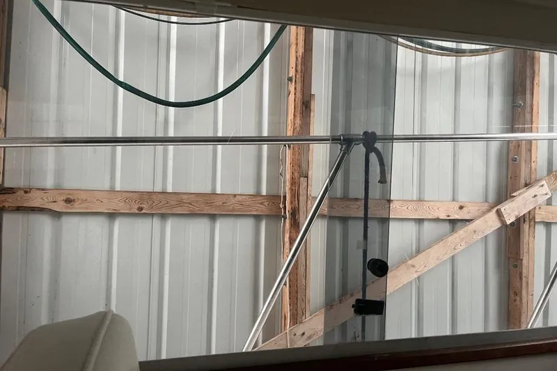 Slide: The Image of Interior view of a 1976 Uniflite 32 Sport Sedan boat, showing metal and wood elements. - 75