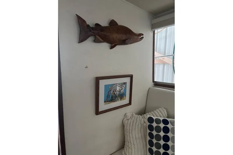 Slide: The Image of Interior of 1976 Uniflite 32 Sport Sedan with fish decor and framed photo. - 78