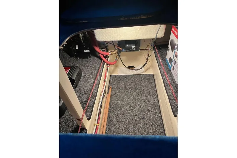 Slide: The Image of Interior view of a 1976 Uniflite 32 Sport Sedan boat, showcasing wiring and equipment. - 79