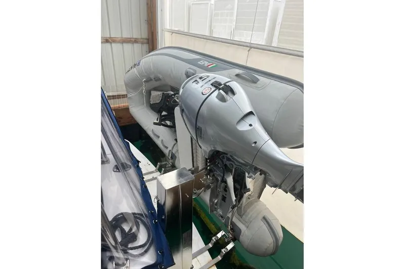 Slide: The Image of 1976 Uniflite 32 Sport Sedan with inflatable boat and outboard motor in storage. - 8