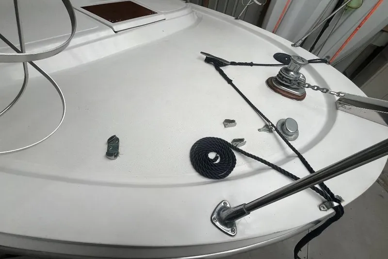 Slide: The Image of 1976 Uniflite 32 Sport Sedan boat deck with ropes and winch. - 9