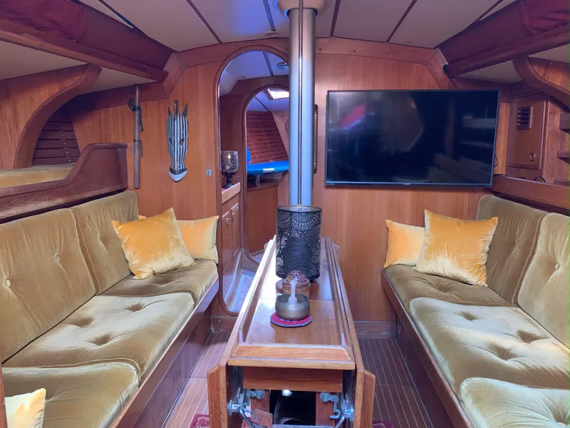 Slide: The Image of Interior of 1980 Nautor Swan 371 yacht with cozy seating and modern TV. - 12