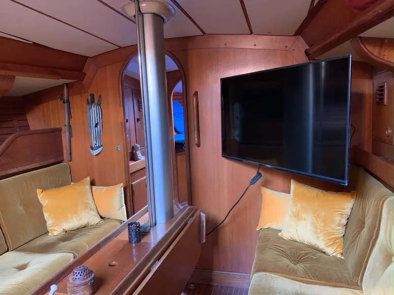 Slide: The Image of Interior of 1980 Nautor Swan 371 yacht with cozy seating and mounted TV. - 14