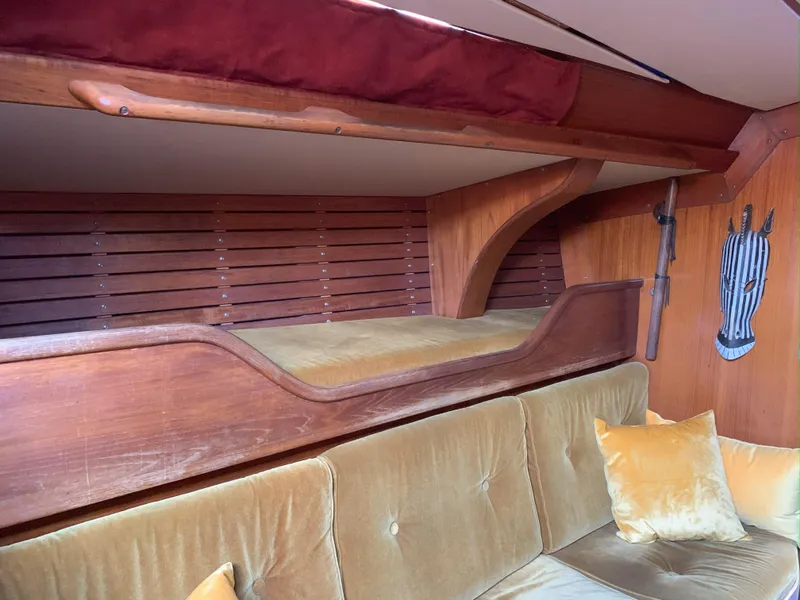 Slide: The Image of Interior of 1980 Nautor Swan 371 yacht with wooden bunk and plush seating. - 16