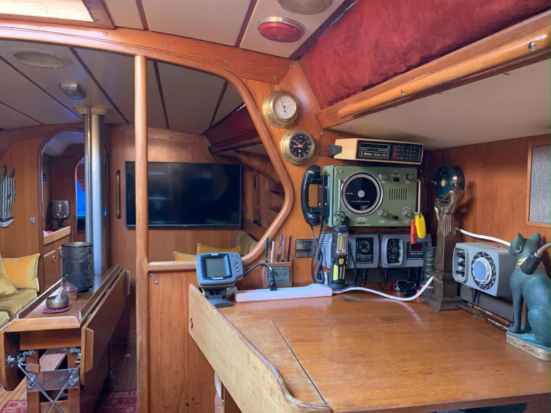 Slide: The Image of Interior of 1980 Nautor Swan 371 yacht with navigation equipment and wooden furnishings. - 18