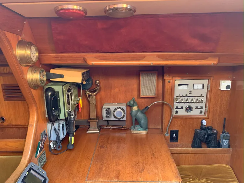 Slide: The Image of Navigation station of 1980 Nautor Swan 371 yacht with vintage equipment and decor. - 19