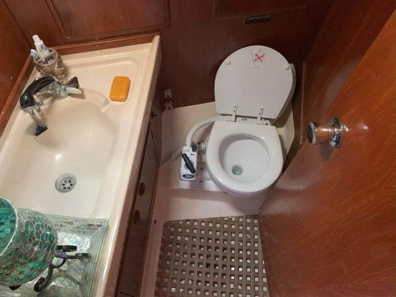 Slide: The Image of Compact bathroom in 1980 Nautor Swan 371 yacht with sink and toilet. - 21