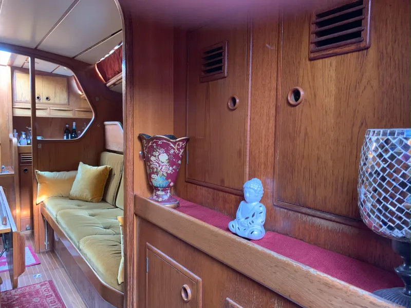 Slide: The Image of Interior of 1980 Nautor Swan 371 yacht with wooden decor and cozy seating. - 22