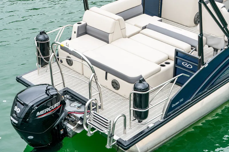 Slide: The Image of Harris Cruiser 190 2026 with Mercury engine on green water. - 10