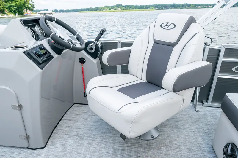 Slide: The Image of Harris Cruiser 190 2026 helm with luxurious captain's chair. - 13