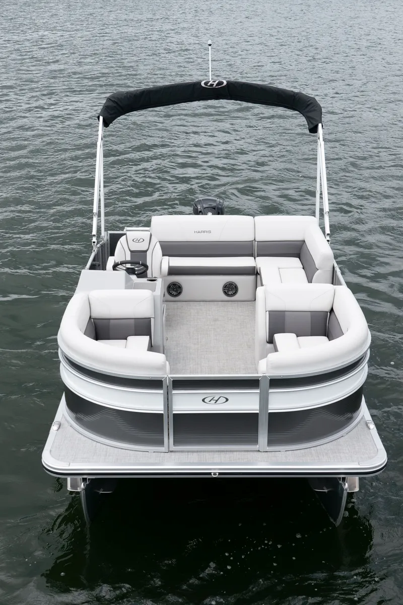 Slide: The Image of Harris Cruiser 190 pontoon boat, 2026 model, on calm water. - 16