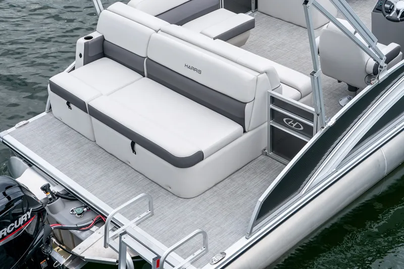 Slide: The Image of 2026 Harris Cruiser 190 with luxurious seating area on the water. - 19