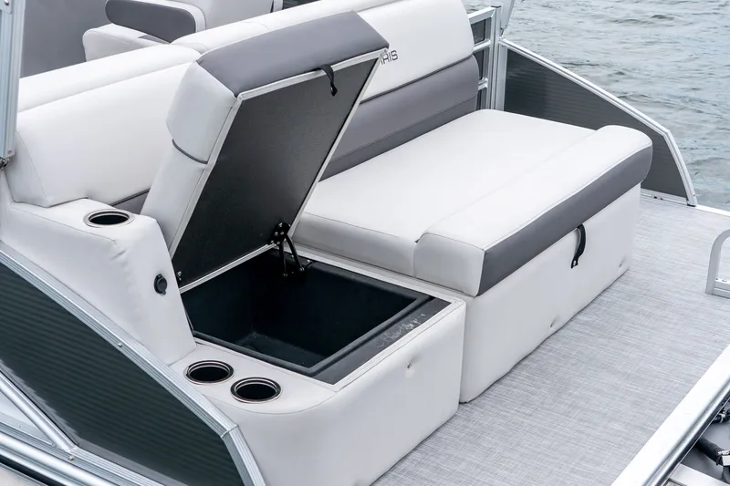 Slide: The Image of Harris Cruiser 190 2026 with open storage compartment and cup holders. - 20