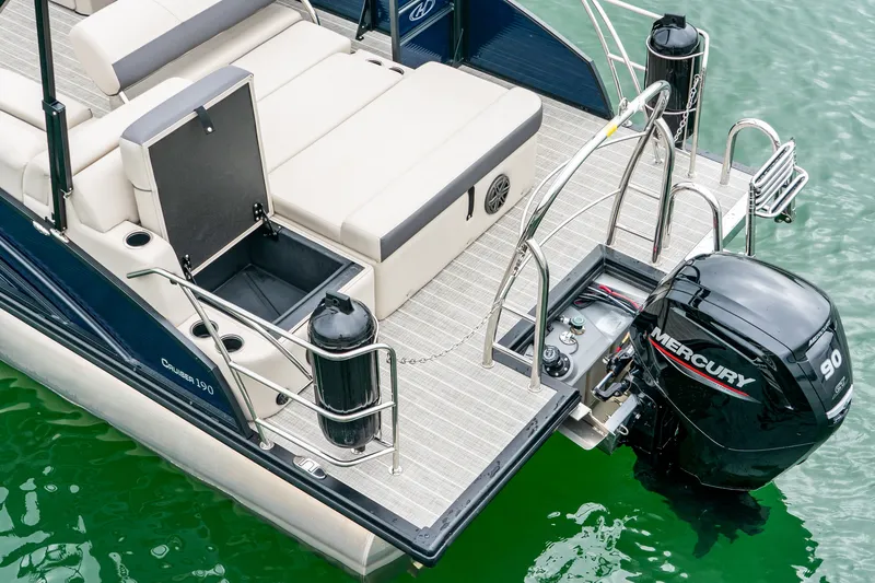 Slide: The Image of Harris Cruiser 190 2026 with Mercury 90 engine on green water. - 7