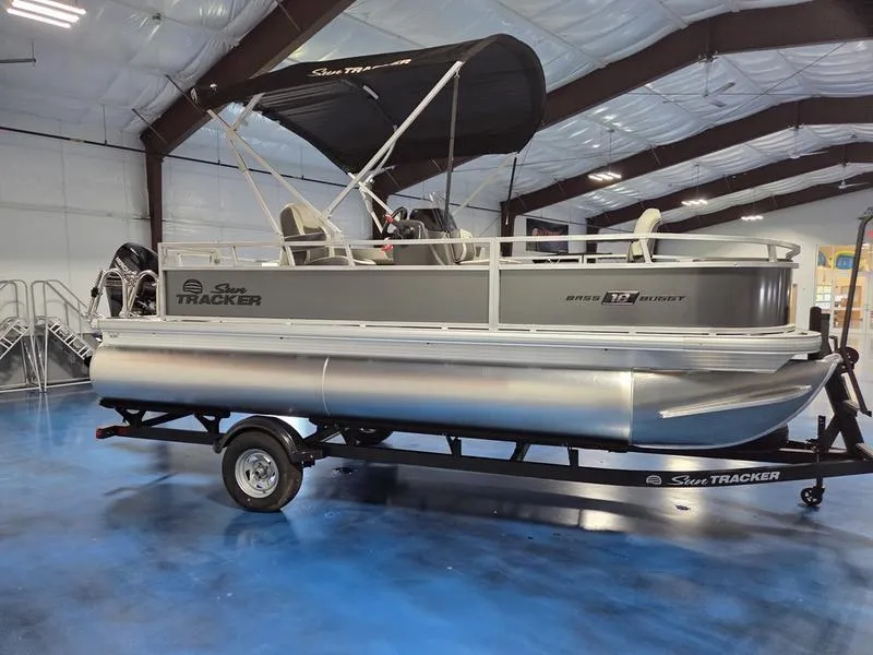 Slide: The Image of 2026 Sun Tracker BB 18 DLX pontoon boat in a showroom, featuring sleek design and modern amenities. - 4
