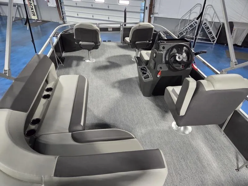 Slide: The Image of Interior of 2026 Sun Tracker BB 18 DLX pontoon boat with seating and steering console. - 8
