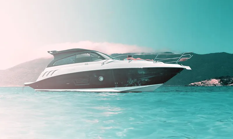 Slide: The Image of 2025 Hanover 355 Outboard boat on serene water with mountainous backdrop. - 19