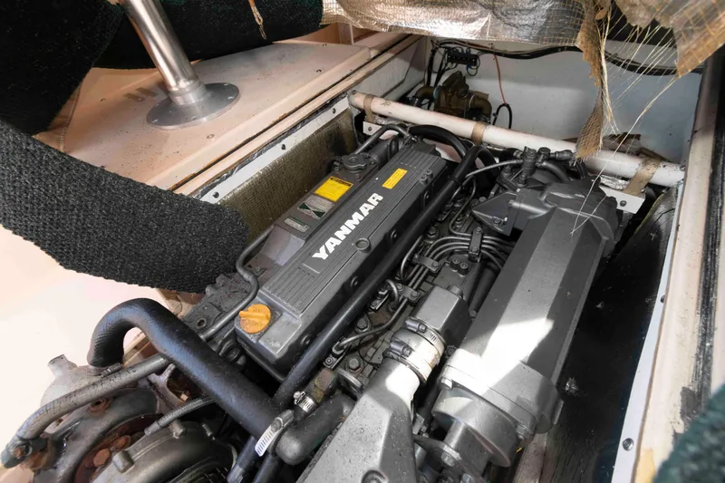 Slide: The Image of Engine compartment of a 2005 Atlas Boat Works Acadia 25, featuring a Yanmar engine. - 14