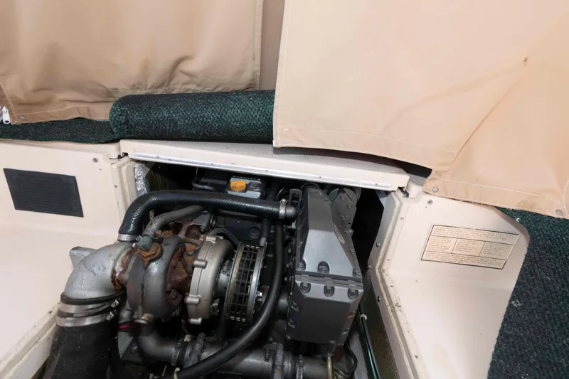 Slide: The Image of Engine compartment of a 2005 Atlas Boat Works Acadia 25, showcasing mechanical components. - 15