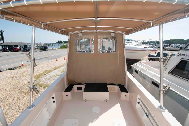 Slide: The Image of 2005 Atlas Boat Works Acadia 25, covered deck view at marina. - 4