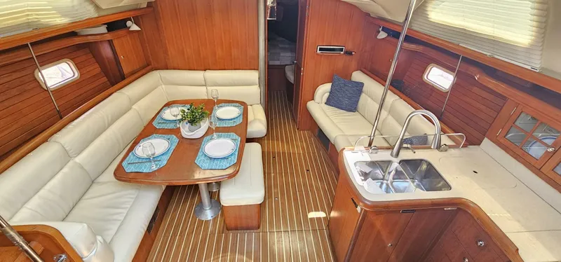 Slide: The Image of Luxurious 2007 Hunter 45 Center Cockpit interior with elegant dining area and modern kitchen. - 2