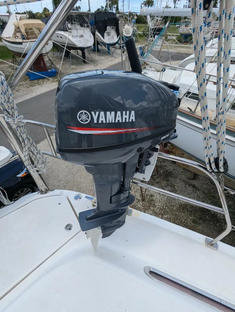 Slide: The Image of Yamaha outboard motor on 2007 Hunter 45 Center Cockpit sailboat, docked in marina. - 25