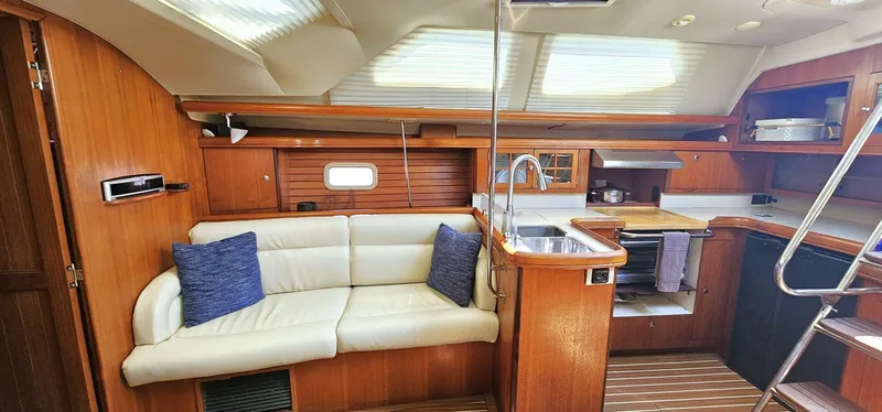 Slide: The Image of Interior of 2007 Hunter 45 Center Cockpit yacht with cozy seating and modern kitchen. - 4