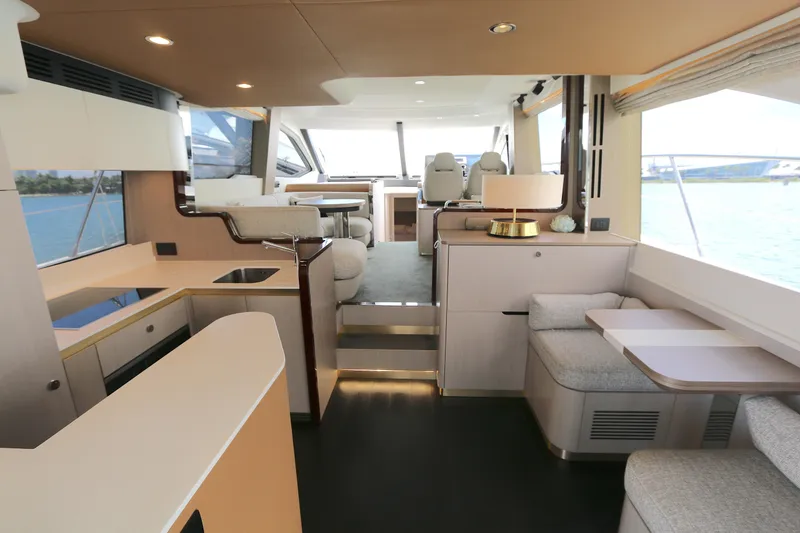 Slide: The Image of Luxurious interior of a 2020 Azimut 55 yacht with modern furnishings and scenic views. - 1