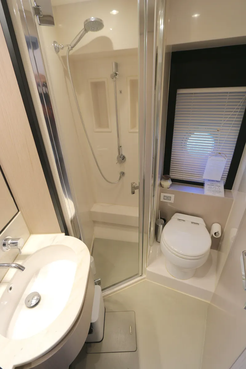 Slide: The Image of Modern bathroom in 2020 Azimut 55 yacht with shower, sink, and toilet. - 12