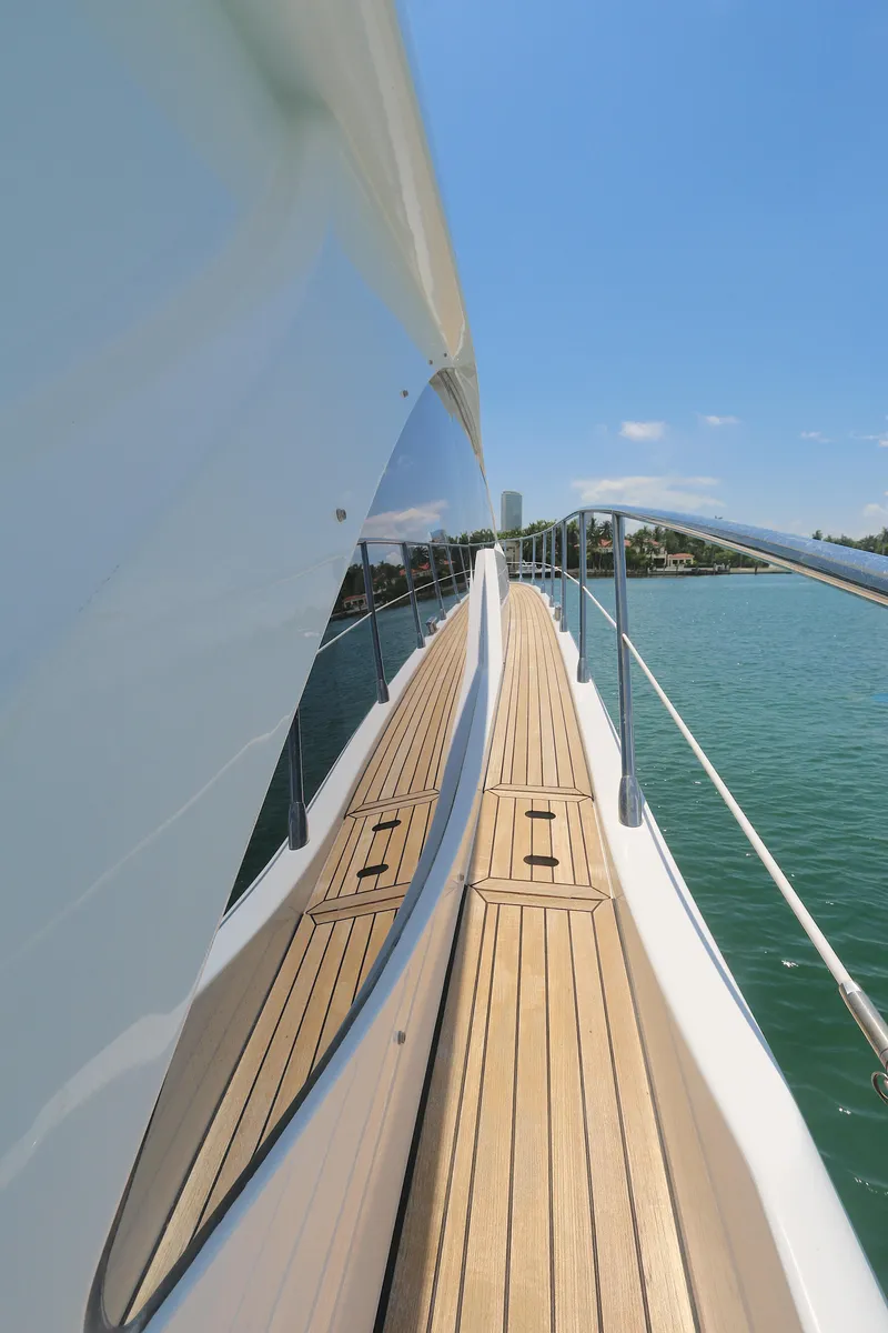 Slide: The Image of Azimut 55 yacht deck, 2020 model, cruising on clear blue waters under a sunny sky. - 18