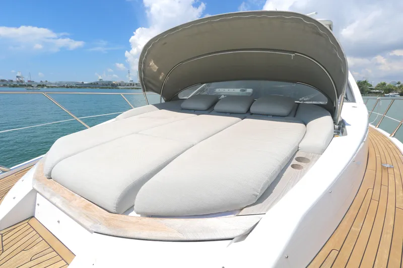 Slide: The Image of Luxurious sunbed on 2020 Azimut 55 yacht, featuring sleek design and ocean backdrop. - 21