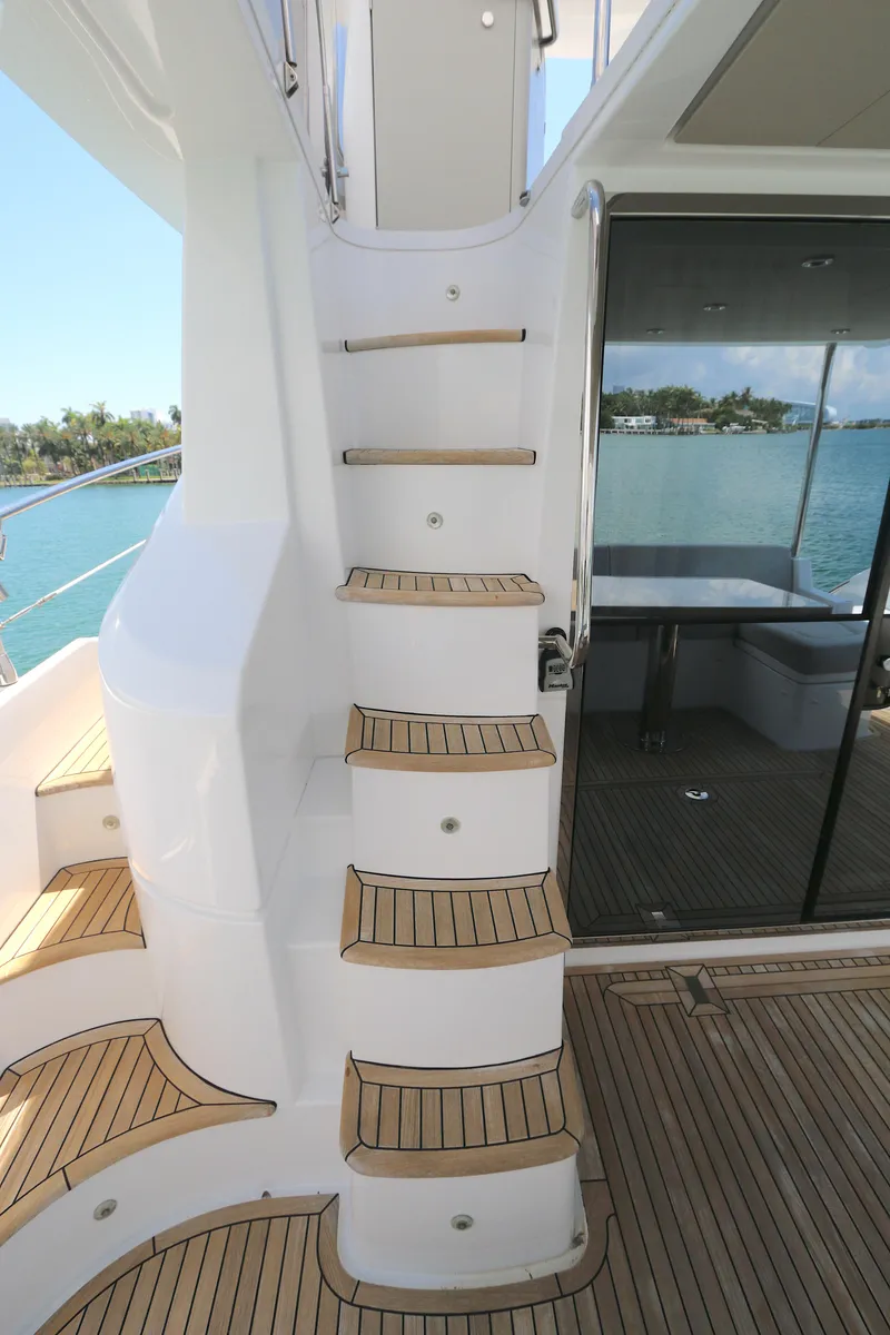 Slide: The Image of Staircase on 2020 Azimut 55 yacht with teak steps and ocean view. - 22