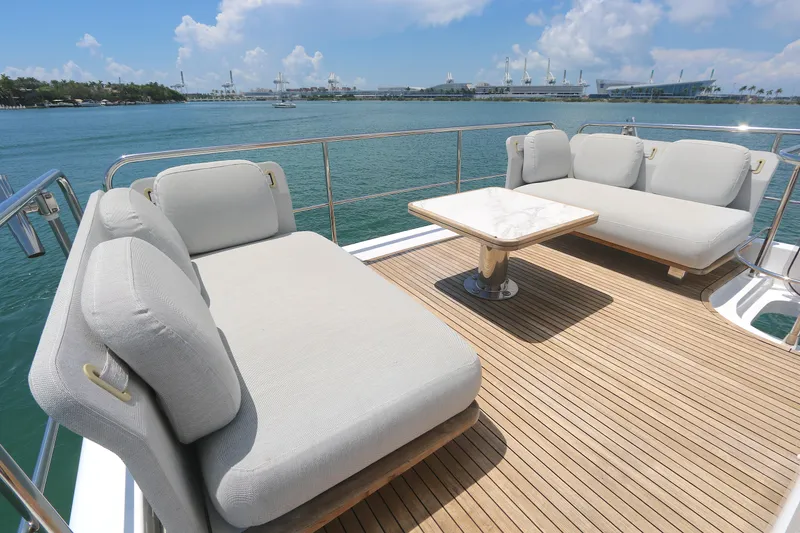 Slide: The Image of Luxurious Azimut 55 yacht deck with plush seating and ocean view, 2020 model. - 23