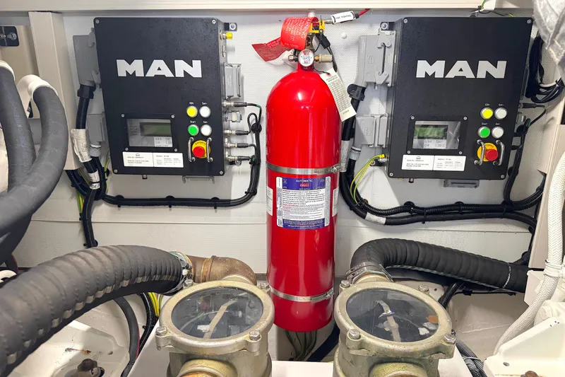 Slide: The Image of Engine room of 2020 Azimut 55 yacht with MAN control panels and fire extinguisher. - 30