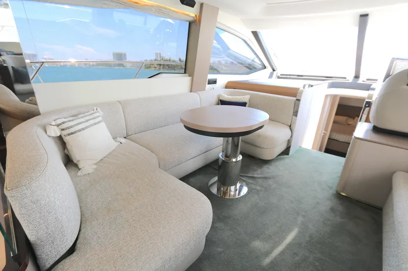 Slide: The Image of Luxurious interior of 2020 Azimut 55 yacht with plush seating and modern decor. - 4