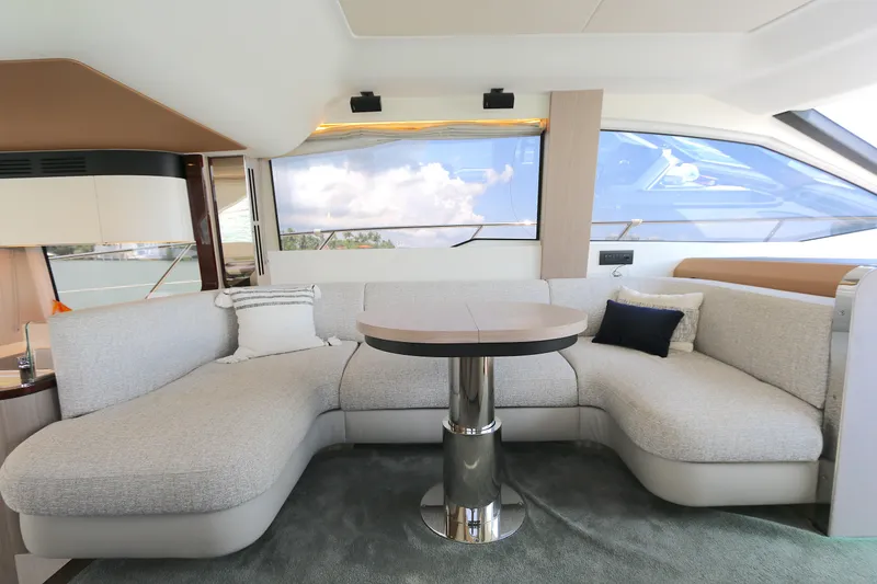 Slide: The Image of Luxurious interior of 2020 Azimut 55 yacht with elegant seating and table. - 6