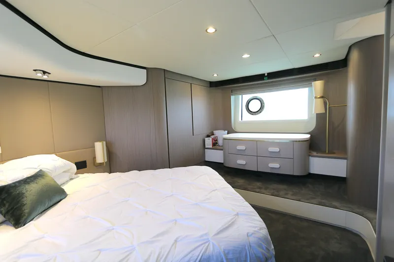 Slide: The Image of Luxurious bedroom interior of 2020 Azimut 55 yacht with modern design and elegant furnishings. - 9