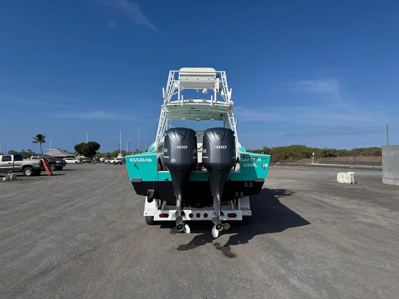 Slide: The Image of Custom 2018 Ocean Master boat with dual Yamaha 300 engines on a sunny day. - 10